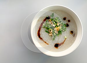 Congee with green onions and oyster, fried garlic