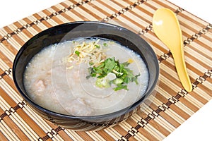 Congee, Rice porridge, Rice gruel, Rice soup on wooden background