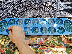 Congklak game is a traditional game played by two people