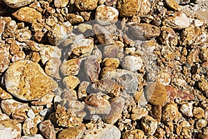 Conglomerate iron stained rock stone wall background photo