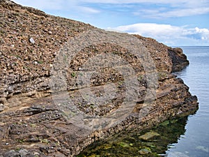 Conglomerate rock on the Ness of Burgi, south Shetland, UK - Hayes Sandstone Formation - Sedimentary Bedrock