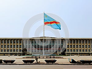 Congolese flag in front of the Congolese National Assembly