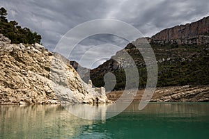 Congost de Mont Rebei, mountain gorge with azure river and canoe, kayaking in Aragon, Catalonia, Spain