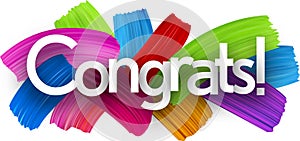 Congrats paper word sign with colorful spectrum paint brush strokes over white.