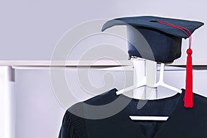 Congratulate graduate.Graduation gown and black hat