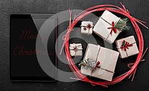 Congratulation for winter holidays, black ipad to write a message for your loved ones.