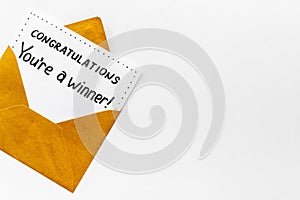 Congratulations award concept -You are a winner card in golden envelope