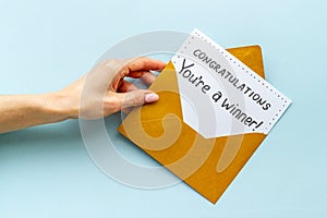 Congratulations award concept -You are a winner card in golden envelope