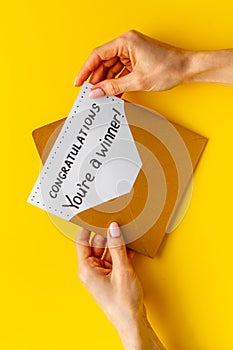 Congratulations award concept -You are a winner card in golden envelope