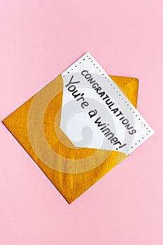 Congratulations award concept -You are a winner card in golden envelope