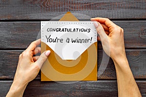 Congratulations award concept -You are a winner card in golden envelope