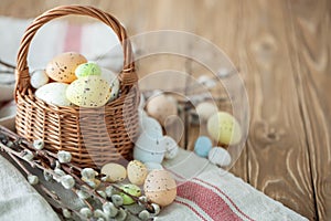 Congratulatory easter background. Easter eggs and flowers. Selective focus. Top view. Background with copy space.