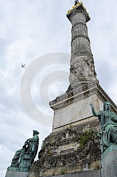 Congress Column, Brussels Belgium with aeroplane flying over head