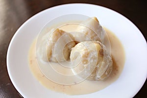Conic ball shaped dessert in cream photo