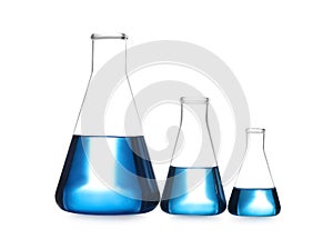 Conical flasks with blue liquid isolated. Laboratory glassware