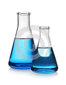 Conical flasks with blue liquid. Laboratory glassware