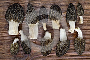 Conical Morel Morchella conica, delicious edible mushrooms, cut and placed on a wooden table.