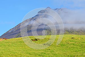 The conical Pico volcano looming over its namesake island Azores archipelago, Portugal