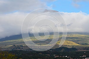 The conical Pico volcano looming over its namesake island Azores archipelago, Portugal