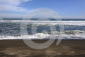 Waves on the beach of Cobquecura, Chile photo