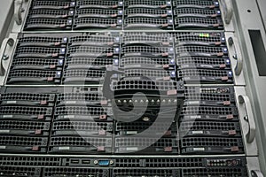 Connect a new hard drive to a stack of computer servers. Replacing a module in a powerful server hardware. Cloud Storage