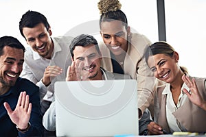 Connect with the world and see your business flourish. a group of businesspeople having a video conference together on a