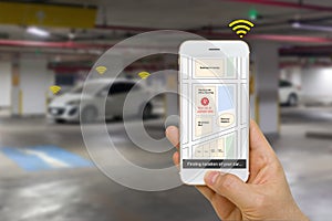 Connected Car Concept Illustrated by Smartphone App Showing Parking Location of the Car Via IOT or Internet of Things Technology