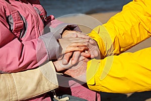 Connected hands of family as support sign