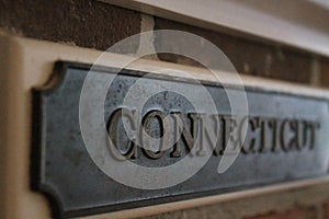 Connecticut sign on brick wall at Epcot photo