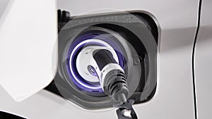 Connecting the Charger Plug of an Electric Hybrid Car