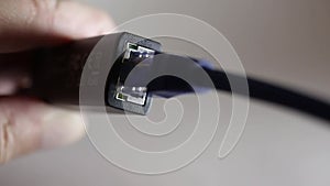 Connecting the Ethernet cable to the adapter close-up.