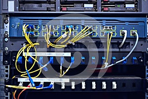 Connecting everyone. the inside of a computer with all of its wiring located in a server room.