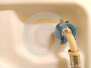 Connecting the hose of the washing machine or dishwasher to the water supply. A pipe is screwed to the body of household