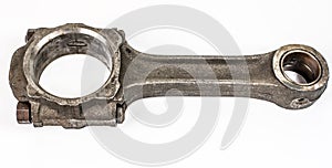 Connecting rod from a car engine. Isolated on white
