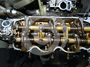 The connecting rod, piston and cylinder block in a disassembled condition