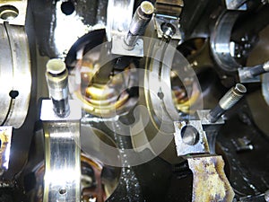 The connecting rod, piston and cylinder block in a disassembled condition