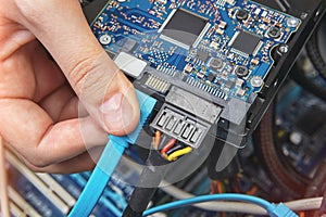 Connecting SATA cable to motherboard of personal computer