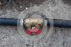 Connecting water valve with blue rubber water hose