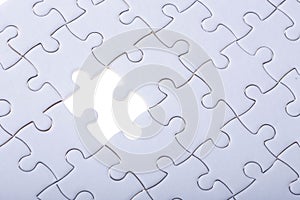 Pattern of jigsaw puzzle and one of missing hole