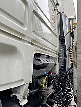Connection panel of pneumatic and electric hoses to the semi-trailer of a truck