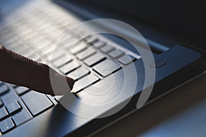 Connectivity and data access, finger pressing the enter key on the laptop computer.