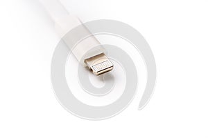 Connector lightning on a white background. This is a proprietary connector used to connect mobile devices to well-known host