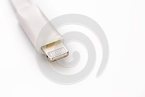 Connector lightning on a white background. This is a proprietary connector used to connect mobile devices to well-known host