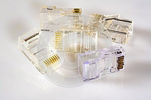 Connector rj-45. Five transparent connectors rj45 for cable for network and internet. Close-up macro on gloss white background