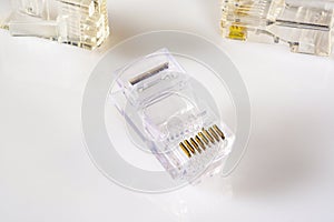 Connector rj-45. Transparent connector rj45 for network and internet. Close-up macro on gloss white background with shadow