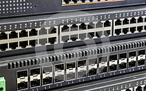 connectors of a large data center network switch. incoming and outgoing outputs
