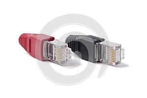 Connectors RJ45 6 category with red and black caps on a white background