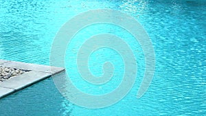 Conner of marble and stone and wave on water surface in pool