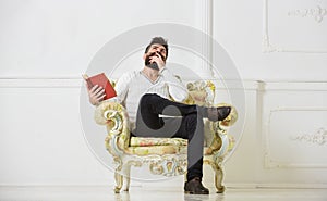 Connoisseur of literature concept. Macho spends leisure with book. Connoisseur, on thoughtful face enjoy literature photo