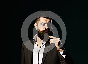 Connoisseur with serious face tasting expensive cabernet wine